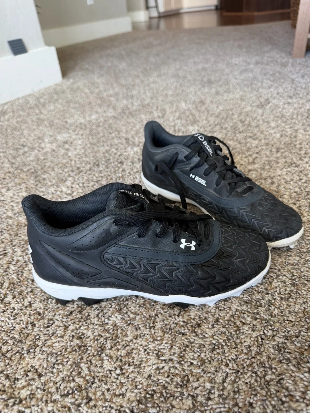 Under Armour Black Cleats with White Soles